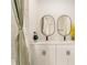 Bathroom featuring a stylish double vanity, elegant mirrors, and a luxurious shower with modern fixtures at 46 Fisher Lane Ter, Ocklawaha, FL 32179