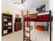 Cozy bedroom features a bunk bed, a ceiling fan and a wooden dresser at 46 Fisher Lane Ter, Ocklawaha, FL 32179