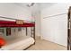 Cozy bedroom features a bunk bed, a ceiling fan and a wardrobe at 46 Fisher Lane Ter, Ocklawaha, FL 32179