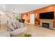 Open-concept living area featuring a fireplace, dining space, and seamless flow to the kitchen at 46 Fisher Lane Ter, Ocklawaha, FL 32179