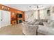 Comfortable living room with a fireplace, plush seating, and ample natural light at 46 Fisher Lane Ter, Ocklawaha, FL 32179