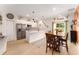 Bright, open floor plan with a modern kitchen, dining area, and stainless steel appliances at 46 Fisher Lane Ter, Ocklawaha, FL 32179