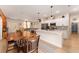 Open-concept living space featuring a modern kitchen, dining area, and seamless flow to the living room at 46 Fisher Lane Ter, Ocklawaha, FL 32179