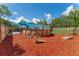 Backyard featuring an above-ground pool with wooden accents and a mulch-covered area at 46 Fisher Lane Ter, Ocklawaha, FL 32179