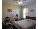 Comfortable bedroom featuring a ceiling fan and decorative artwork, creating a relaxing atmosphere at 4770 Sw 114Th St, Ocala, FL 34476