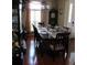Elegant dining room featuring a large table set for a formal meal, with a window view at 4770 Sw 114Th St, Ocala, FL 34476