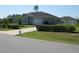 Charming single-story home featuring a well-maintained lawn and a long private driveway leading to an attached garage at 4770 Sw 114Th St, Ocala, FL 34476