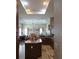 Well-equipped kitchen with an island and modern appliances, seamlessly flowing into the living area at 4770 Sw 114Th St, Ocala, FL 34476