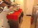 Practical laundry room setup with modern appliances, ample counter space, and organized storage solutions at 4770 Sw 114Th St, Ocala, FL 34476