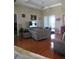 Spacious living room featuring hardwood floors, comfortable seating, and a bright, airy atmosphere at 4770 Sw 114Th St, Ocala, FL 34476