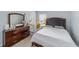 Bedroom featuring a bed, dresser, and crib with modern fixtures at 4927 Sw 45Th Cir, Ocala, FL 34474