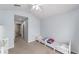Well-lit bedroom featuring carpeted floors, and neutral walls at 4927 Sw 45Th Cir, Ocala, FL 34474