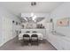Adjacent dining area features stylish pendant lighting and convenient access to the kitchen and entry foyer at 4927 Sw 45Th Cir, Ocala, FL 34474