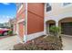 Townhome entrance featuring decorative trim and a covered porch at 4927 Sw 45Th Cir, Ocala, FL 34474