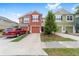 Inviting townhome with a well-kept lawn, private driveway, and colorful facade at 4927 Sw 45Th Cir, Ocala, FL 34474