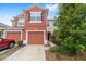 Two-story townhome with a single-car garage and well-maintained landscaping at 4927 Sw 45Th Cir, Ocala, FL 34474