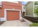 Townhome with a single-car garage, landscaping, and a colorful exterior at 4927 Sw 45Th Cir, Ocala, FL 34474