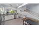 Spacious kitchen boasts granite counters, white cabinets, and an open design leading to the dining and living areas at 4927 Sw 45Th Cir, Ocala, FL 34474