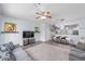 Relaxing living room and dining area adjacent to the kitchen, perfect for Gathering gatherings and entertaining guests at 4927 Sw 45Th Cir, Ocala, FL 34474