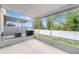 Screened-in patio showcasing the backyard view and AC unit at 4927 Sw 45Th Cir, Ocala, FL 34474