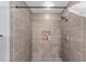 Modern tiled shower featuring a rainfall shower head and built-in niche at 4927 Sw 45Th Cir, Ocala, FL 34474