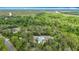 Aerial view of home on wooded acreage in a tranquil, forested setting at 505 Fisher Rd, Ocklawaha, FL 32179
