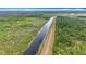 Aerial of the drainage canal bordering the property at 505 Fisher Rd, Ocklawaha, FL 32179