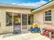 Covered screened-in lanai for outdoor relaxation and view of spacious backyard at 505 Fisher Rd, Ocklawaha, FL 32179