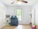 Bright bedroom features laminate floors, ample natural light, and a playful play area for children at 505 Fisher Rd, Ocklawaha, FL 32179