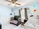 Charming bedroom featuring cartoon decorations and tile floors, designed for comfort and imagination at 505 Fisher Rd, Ocklawaha, FL 32179