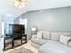 Comfortable living room featuring modern media center and neutral color palette at 505 Fisher Rd, Ocklawaha, FL 32179