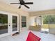 Covered, screened-in back porch for outdoor dining and relaxation while enjoying the back yard views at 505 Fisher Rd, Ocklawaha, FL 32179