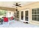 Back patio with screened-in lanai and outdoor seating is perfect for relaxing at 505 Fisher Rd, Ocklawaha, FL 32179