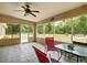 Screened-in lanai features outdoor seating with expansive views of the serene, wooded backyard at 505 Fisher Rd, Ocklawaha, FL 32179