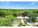 Charming single Gathering home with mature trees on an expansive lot at 518 Saint Andrews Blvd, Lady Lake, FL 32159