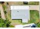 Aerial view of a house with a grey roof at 518 Saint Andrews Blvd, Lady Lake, FL 32159