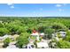 Quaint single Gathering home surrounded by lush greenery and mature trees at 518 Saint Andrews Blvd, Lady Lake, FL 32159