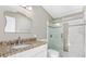 Bathroom featuring granite countertop vanity and glass shower at 518 Saint Andrews Blvd, Lady Lake, FL 32159