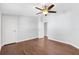 Bright bedroom with hardwood floors and ceiling fan at 518 Saint Andrews Blvd, Lady Lake, FL 32159
