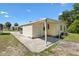 Home with a driveway and covered carport at 518 Saint Andrews Blvd, Lady Lake, FL 32159
