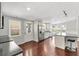Modern kitchen featuring an island, stainless steel appliances, and hardwood floors at 518 Saint Andrews Blvd, Lady Lake, FL 32159