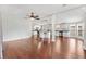 Spacious living area flowing into kitchen with stainless steel appliances and center island, perfect for entertaining at 518 Saint Andrews Blvd, Lady Lake, FL 32159