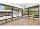Sunroom with light wood floors and glass windows at 518 Saint Andrews Blvd, Lady Lake, FL 32159