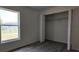 Cozy bedroom with light gray flooring, a window, and a closet at 5323 Nw 8Th Pl, Ocala, FL 34482