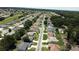 An aerial view displays neighborhood with houses, green spaces, and proximity to golf courses and roadways at 5340 Nw 26Th Ln, Ocala, FL 34482