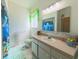 Bathroom with a dolphin-themed shower curtain at 5340 Nw 26Th Ln, Ocala, FL 34482