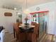 Inviting dining room featuring a chandelier, modern decor, and a sliding door to the outside at 5340 Nw 26Th Ln, Ocala, FL 34482