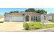 Charming single-story home featuring a well-manicured lawn and a spacious two-car garage at 5340 Nw 26Th Ln, Ocala, FL 34482