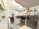 Cozy kitchen featuring white cabinets, stainless steel appliances, tile flooring, and decor at 5340 Nw 26Th Ln, Ocala, FL 34482