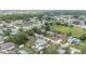 Aerial view of a residential neighborhood featuring tree-lined streets and well-kept homes and lawns at 5437 Se 34Th St, Ocala, FL 34480